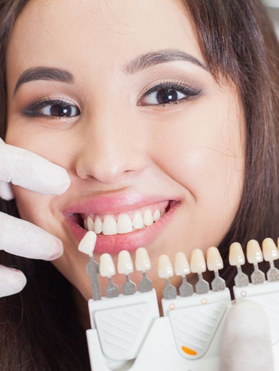 Young woman being fitted for dental veneers